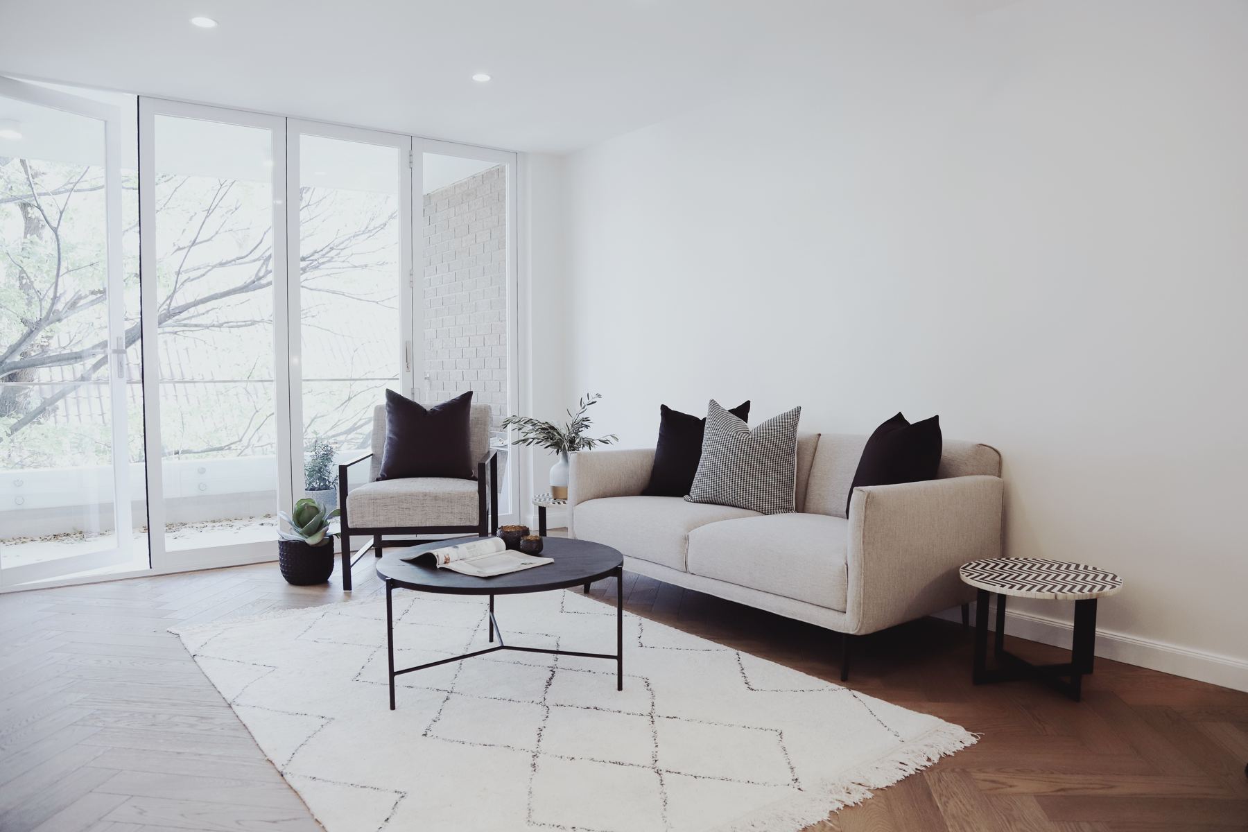 Renovated apartment living room with tall windows
